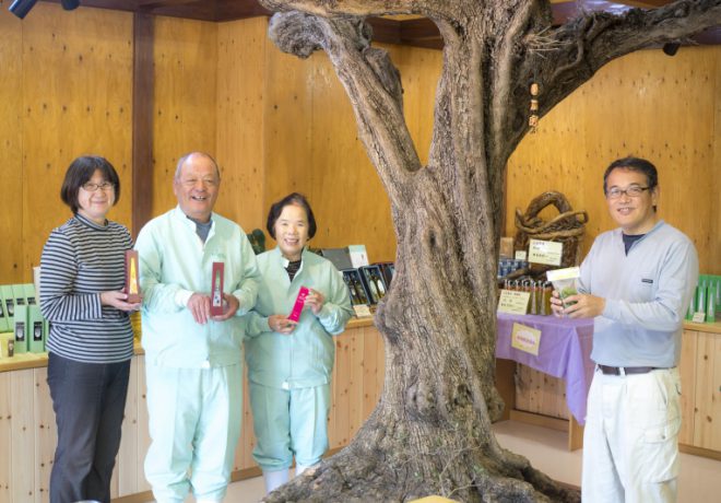 Group photo of smiling face with product in hand